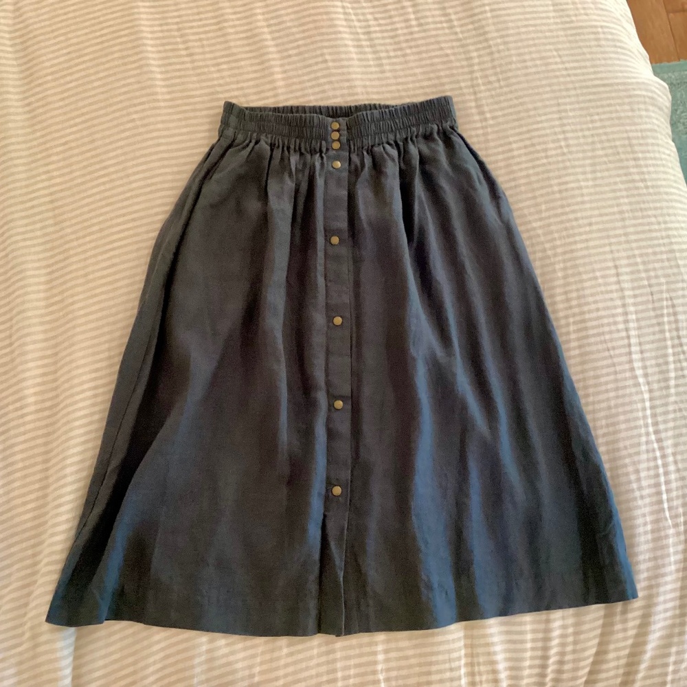 NPL — modified Sion L in dark grey-blue
